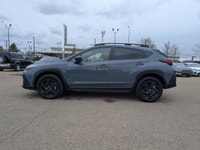 The pre-owned 2024 Subaru Crosstrek Onyx in Blue with a Grey interior delivers rugged versatility, m... (image 2)