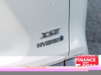 The 2019 Toyota RAV4 Hybrid XSE in pristine white exudes confidence on the road with its capable AWD... (image 7)