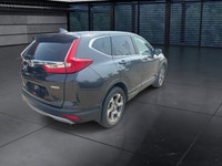 The 2018 Honda CR-V EX-L AWD in striking gray is the perfect blend of versatility and style, designe... (image 8)