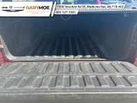 Experience the bold presence of the 2023 Ram 1500 Laramie in stunning red with the unstoppable 44 dr... (image 4)