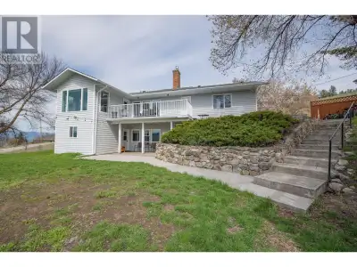 Enjoy the country lifestyle and space on this large one-acre lot with stunning views of Swan Lake an...