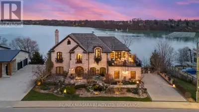 Pristine waterfront living meets timeless European elegance. This extraordinary custom-built two-sto...