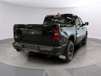 Experience the power and versatility of the new 2026 Ram 1500 Warlock in a striking black finish. Th... (image 4)