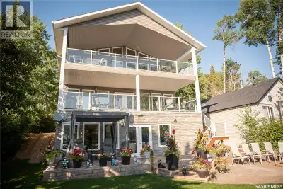 Experience luxury lakefront living at its finest in this stunning south-facing waterfront estate. Sh...