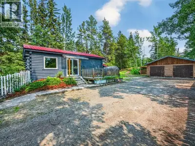 The Ultimate Yukon Base Camp! Beautifully updated 2-bedroom, 1-bath log home blending authentic Yuko...