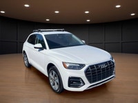 The 2021 Audi Q5 Komfort 45 TFSI quattro boasts a stunning white exterior that is both timeless and... (image 3)