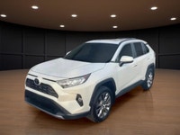 Presenting the 2019 Toyota RAV4 AWD Limited in a pristine white finish, perfect for tackling Canadia... (image 1)