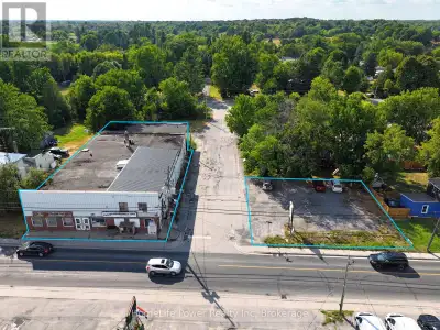 Mixed-use commercial property with surface parking lot in the Village of Verona, South Frontenac Tow...