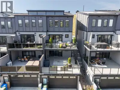 Perched high in Springbank Hill, this modern three-storey townhome offers over 2,500 sq ft of though...