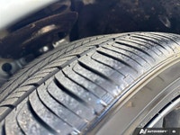 The *2024 Toyota Camry Hybrid SE* combines aggressive sport styling with class-leading fuel efficien... (image 9)