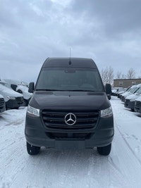 black-on-black Mercedes-Benz Sprinter van. This well-maintained vehicle offers a blend of luxury and... (image 5)