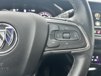 The 2023 Buick Envision Essence, presented in a sophisticated Gray finish, masterfully blends luxuri... (image 9)