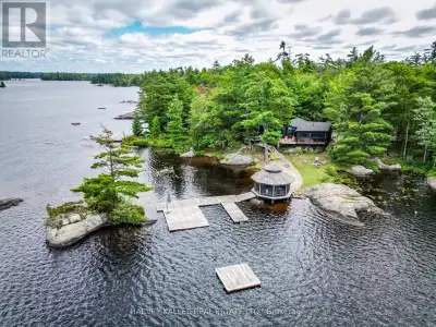 Less than two hours from Toronto, discover an exceptional Kahshe Lake waterfront estate with coveted...