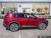 Experience enhanced visibility and an open-air feel in this stunning red 2021 Nissan Rogue SV, featu... (image 5)
