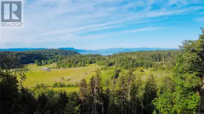 A truly unique and picturesque country acreage awaits! 10 Acres within the ALR with ocean views! The...