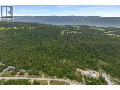 2.47 acre lot with valley and mountain views on a beautiful treed lot in Ranchero Heights. This lot...