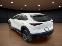 The 2022 Mazda CX-30 GT w/Turbo AWD in stunning white exudes confidence and offers a smooth handling... (image 7)