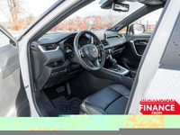 The 2019 Toyota RAV4 Hybrid XSE in pristine white exudes confidence on the road with its capable AWD... (image 9)