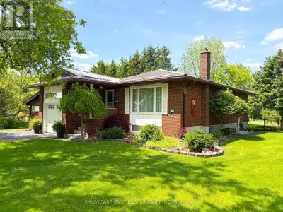 This well-maintained, move-in ready brick bungalow has been lovingly cared for by its original owner...