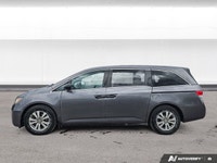 Experience the comfort and practicality of this pre-owned minivan, finished in elegant Alabaster Gre... (image 1)