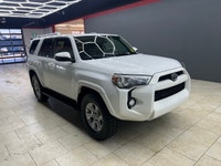 The 2015 Toyota 4Runner 4WD 4dr V6 SR5, in its striking White exterior paired with a robust 44 drive... (image 5)