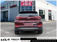 Experience the 2016 Hyundai Tucson Ultimate in its striking red exterior, offering the confidence of... (image 2)