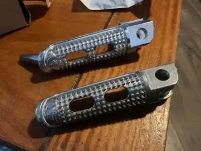 NOS Buell XB12R FireBolt Rider & Passenger Footpegs $80CAD Rider peg N0520.02A8 $50CAD Pass peg N055...