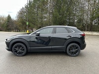 // ACCIDENT FREE!! // Finished in Black with a Burgundy interior, this used 2022 Mazda CX-30 GT w/Tu... (image 9)