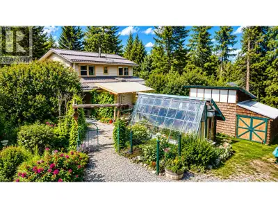 Private 1.19-acre retreat just 7 minutes from town! This charming 2,053 sq. ft. two-storey home offe...