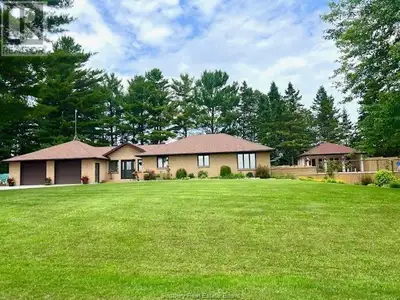 CUSTOM-BUILT WATERFRONT OASIS! Welcome to this stunning all-brick, custom-built bungalow offering 1,...