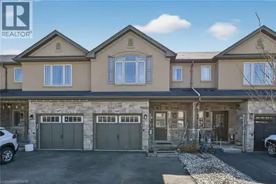 Beautifully upgraded 3-bedroom, 4-bathroom townhome with a finished basement and private backyard, l...