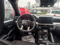This Toyota Tacoma boasts a Intercooled Turbo Regular Unleaded I-4 2.4 L/146 engine powering this Au... (image 8)
