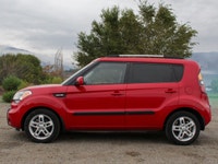 The 2011 Kia Soul 2u in a vibrant red with front-wheel drive is a vehicle built for handling the dem... (image 6)