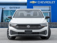 The 2024 Volkswagen Jetta Comfortline stands out in a refined White finish that complements its slee... (image 1)