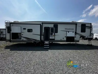 Forest River Wildwood Heritage Glen fifth wheel 370BL highlights: Middle Bunkhouse Loft Theatre Seat...