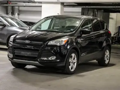 The 2014 Ford Escape SE is an SUV that stands out with its sleek Tuxedo Black color and robust 44 dr...