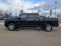 The 2026 Ram 2500 Laramie Mega Cab in Diamond Black Crystal Pearl combines heavy-duty capability wit... (image 2)