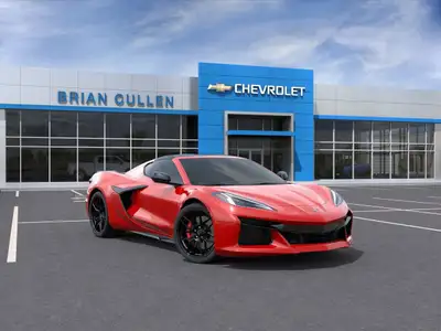The 2025 Chevrolet Corvette Z06 Coupe 2LZ roars to life with its vibrant red exterior, matched by a...