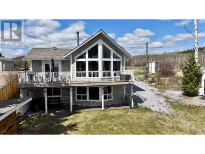 Spectacular home with a guest cabin on Fraser Lake with stunning lake views and a wonderful beachfro...