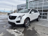 The 2026 Cadillac XT5 Sport AWD, finished in Crystal White Tricoat with a rich Kona Brown interior w... (image 3)