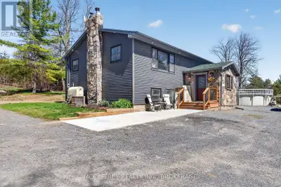 Welcome to peaceful country living in this lovely updated bungalow, set on just over an acre of pict...