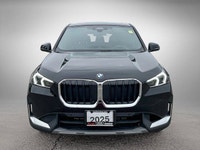 The 2025 BMW X1 xDrive28i arrives as a striking black Sport Utility vehicle, seamlessly blending ath... (image 1)