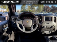 The 2026 Chevrolet Silverado 2500HD Work Truck in pristine white and equipped with a rugged 4x4 driv... (image 8)