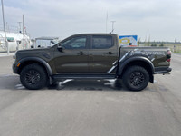 The 2024 Ford Ranger Raptor, finished in Shelter Green with refined Ebony leather-trimmed seats, is... (image 4)