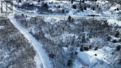 Elevated acreage (8.92A) with several build opportunities. Privacy and convenience (highway plowed a...