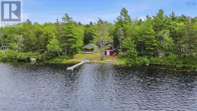 Tucked away on Jims Boulder Road in North Range, this charming lakeside retreat is where unforgettab...
