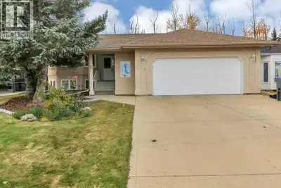 FULLY DEVELOPED 4 BEDROOM, 3 BATHROOM HOME ~ HEATED OVERSIZED DOUBLE ATTACHED GARAGE ~ WEST FACING B...