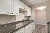 Amenities: Air Conditioning • Spacious Rooms • Heat & Water Included Suite & Building: Bachelor, one... (image 5)