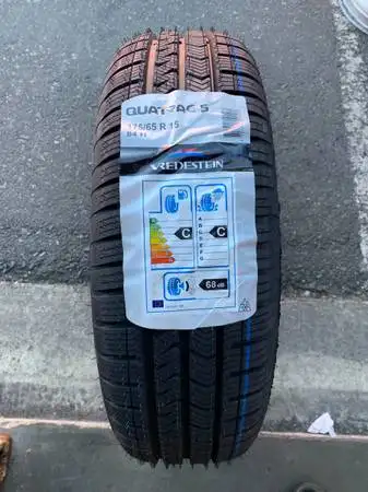 a Brand new PAIR of All weather (4 SEASONS WINTER APPROVED) tires with stickers (2 TIRES ONLY) size...