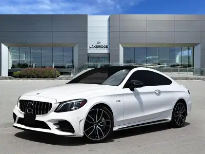 Finished in White with a Black interior, this used 2022 Mercedes-Benz C 43 AMG 4matic Coupe blends e...